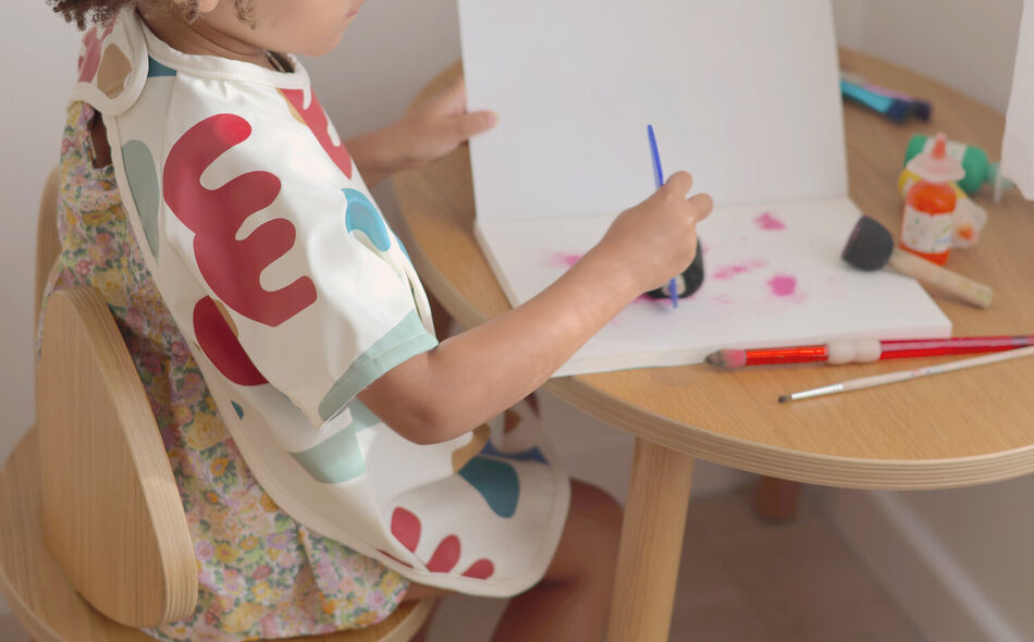 2 in 1 Evolutionary Bib with removable handle and foldable pocket - Playful 